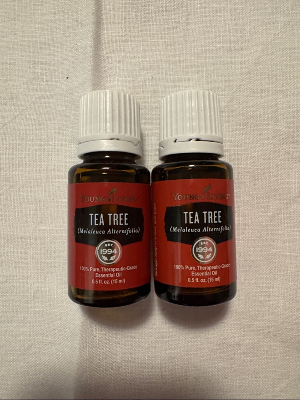 Pair of unopened Young Living Tea Tree Essential Oil